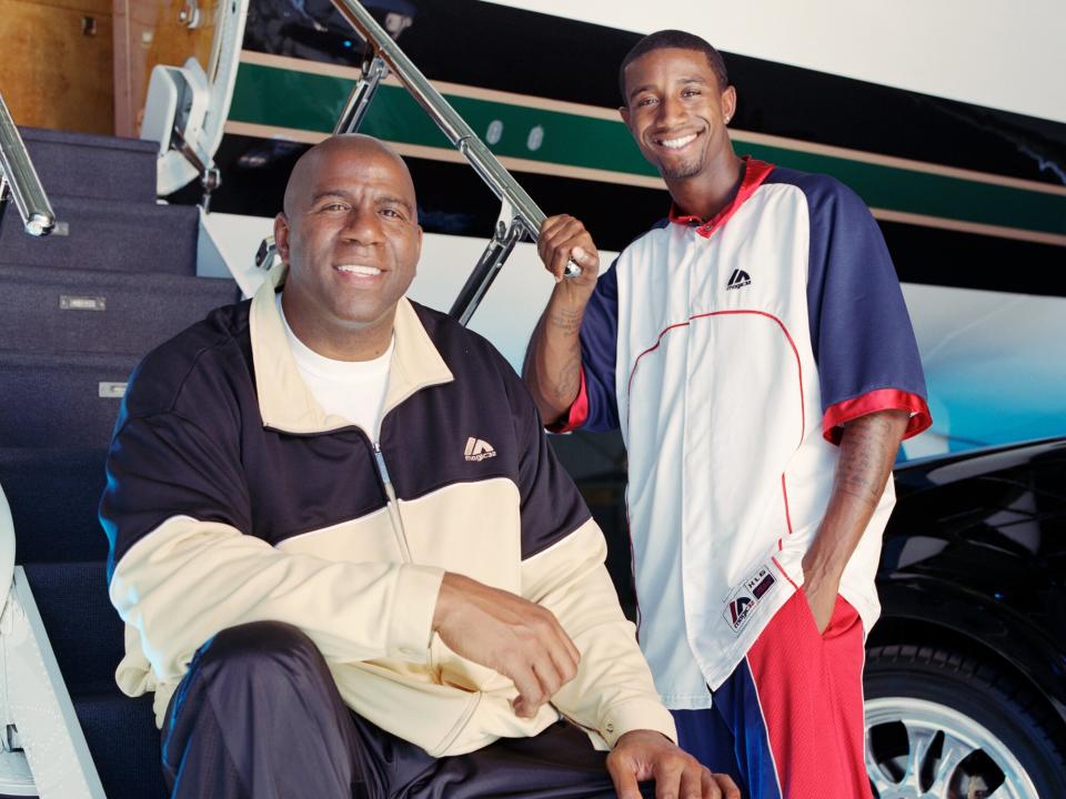 Magic Johnson and his son, Andre Johnson at Van Nuys airport in October, 2005 in Van Nuys, California