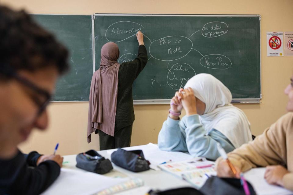 PHOTO: A student writes on a blackboard during a class at Averroes high school in Lille, northern France on Sept. 28, 2023. (Sameer Al-doumy/AFP via Getty Images)