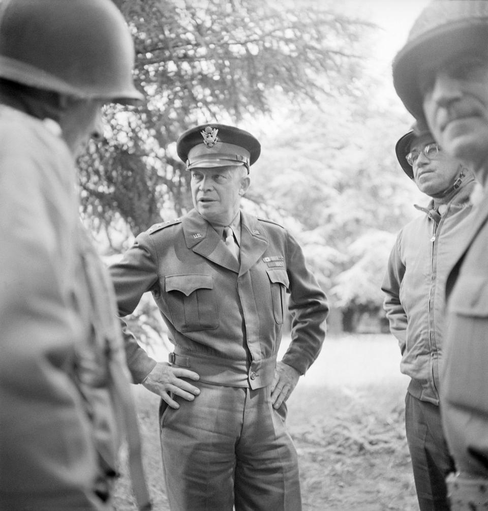 general dwight d eisenhower talking with soldiers