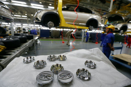 FILE PHOTO: Logos of BYD for tyres are seen at an assembly line of the automobile maker in Shenzhen, China May 25, 2016. REUTERS/Bobby Yip/File Photo