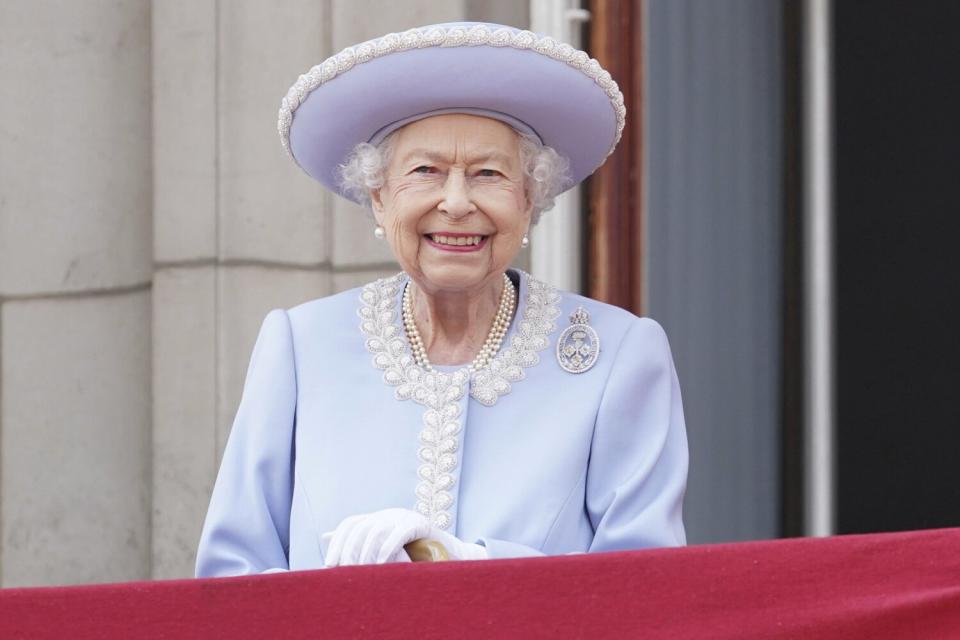 Queen Elizabeth II watches from the balcony of Buckingham Place after the Trooping the Color ceremony