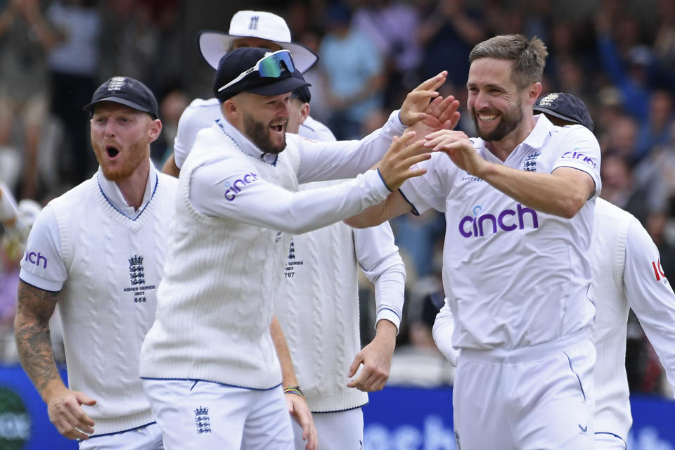 England's Chris Woakes, right, celebrates with teammates the dismissal of Australia's Marnus Labuschagne during the first day of the third Ashes Test match between England and Australia at Headingley, Leeds, England, Thursday, July 6, 2023. (AP Photo/Rui Vieira)