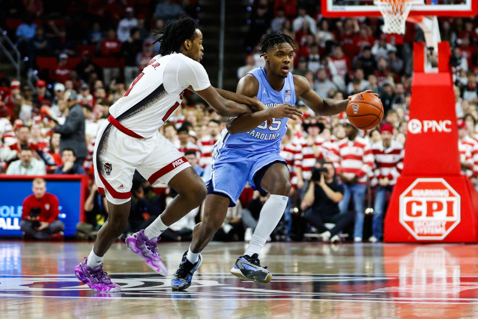 Jan 10, 2024; Raleigh, North Carolina, USA; North Carolina Tar Heels forward Harrison Ingram (55) dribbles with the ball during the first half against North Carolina State Wolfpack at PNC Arena. Mandatory Credit: Jaylynn Nash-USA TODAY Sports