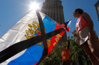 <p>Demonstrators wave Russian flags as they take part in an anti-Trump “March for Truth” rally at Foley Square on June 3, 2017 in New York City. (Photo: Eduardo Munoz Alvarez/Getty Images) </p>