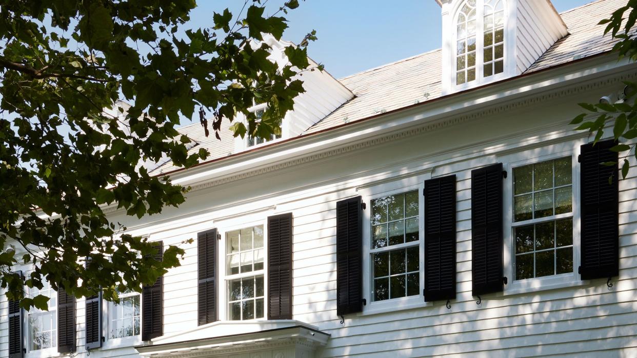 a white house with a red door