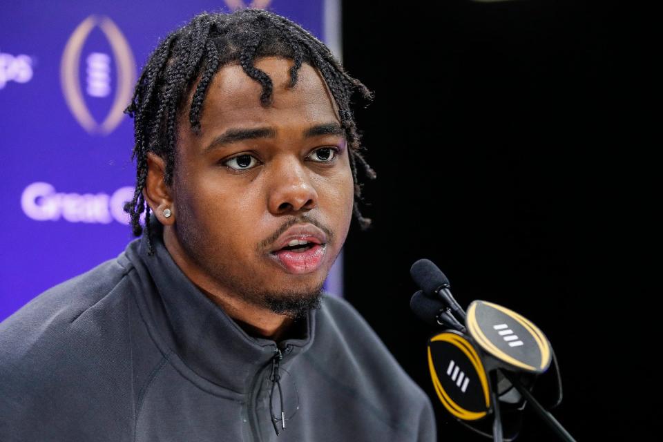 Michigan defensive end Jaylen Harrell (32) speaks during Media Day at George R. Brown Convention Center in Houston, Texas on Saturday, Jan. 6, 2024.