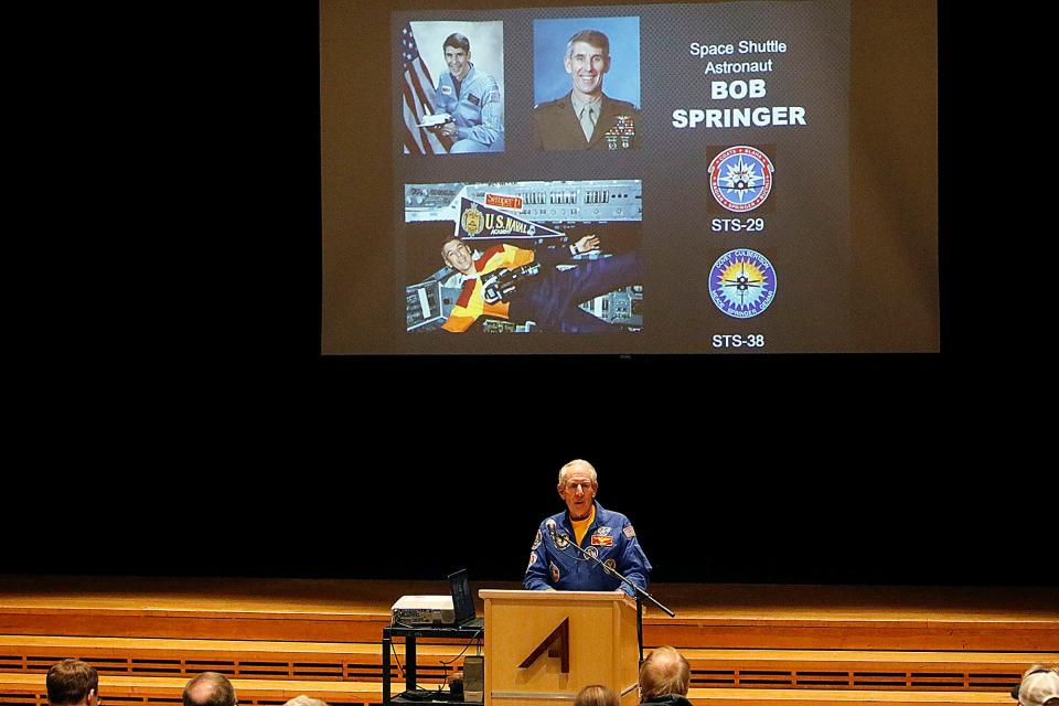 Col. Robert Springer gives his Space Talk hosted by the Ashland County Historical Society at Ashland High School's Little Theater on Thursday, March 10, 2022. Springer is a 1960 graduate of Ashland High School and was a mission specialist on the 1989 space shuttle Discovery mission and also served on the crew of the space shuttle Atlantis in 1990. TOM E. PUSKAR/TIMES-GAZETTE.COM