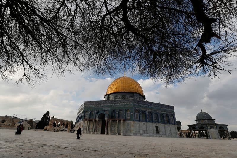 People walk next to the Dome of the Rock on the compound known to Jews as Temple Mount and to Muslims as Noble Sanctuary, in Jerusalem's Old City