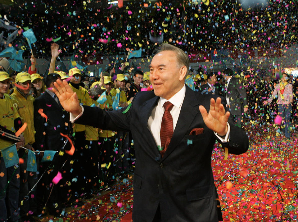 FILE - In this Dec. 5, 2005, file photo, Kazakhstan's President Nursultan Nazarbayev waves to supporters after his victory in Sunday's presidential election was officially announced in the capital of Astana. Nazarbayev, the only leader that independent Kazakhstan has ever known, abruptly announced his resignation Tuesday, March 19, 2019, after three decades in power. (Presidential Press Service/Pool Photo via AP, File)