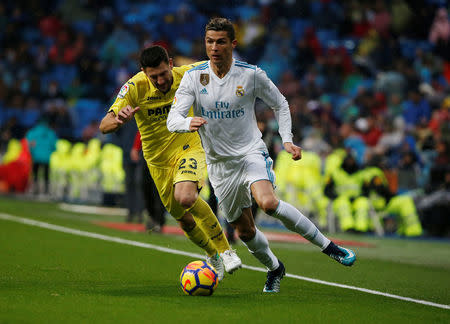 Soccer Football - La Liga Santander - Real Madrid vs Villarreal - Santiago Bernabeu, Madrid, Spain - January 13, 2018 Real Madrid’s Cristiano Ronaldo in action with Villarreal's Daniele Bonera REUTERS/Javier Barbancho