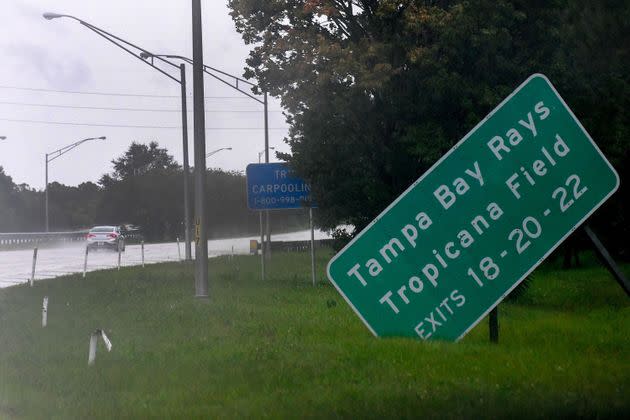 A damaged sign sits on the side of state road I-275 as Hurricane Ian approaches Wednesday in St. Petersburg. (Photo: Gerardo Mora via Getty Images)