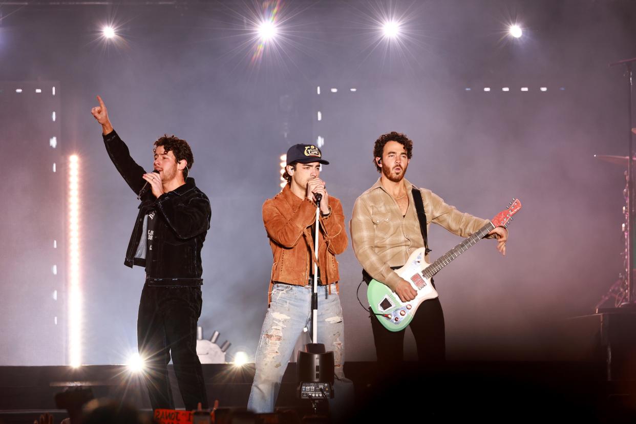 (From left) Nick Jonas, Joe Jonas and Kevin Jonas of The Jonas Brothers performs onstage during AT&T Playoff Playlist Live at Banc of California Stadium on Jan. 7, 2023, in Los Angeles.
