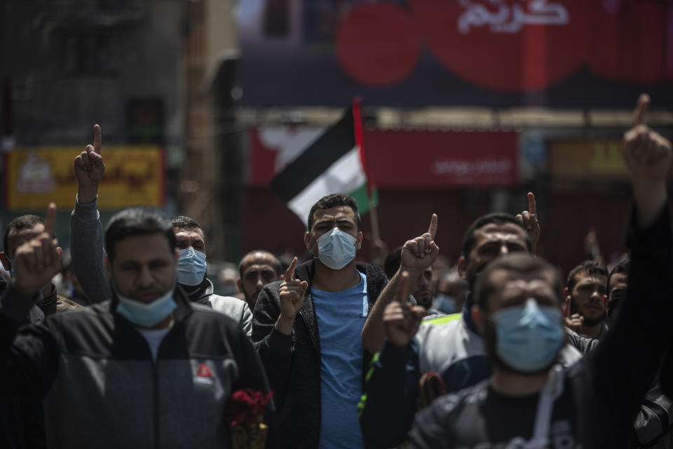 Palestinian Hamas supporters chant anti Israel slogans during a protest in solidarity with Muslim worshippers in Jerusalem, in Gaza City, Friday, April. 23, 2021. (AP Photo/Khalil Hamra)