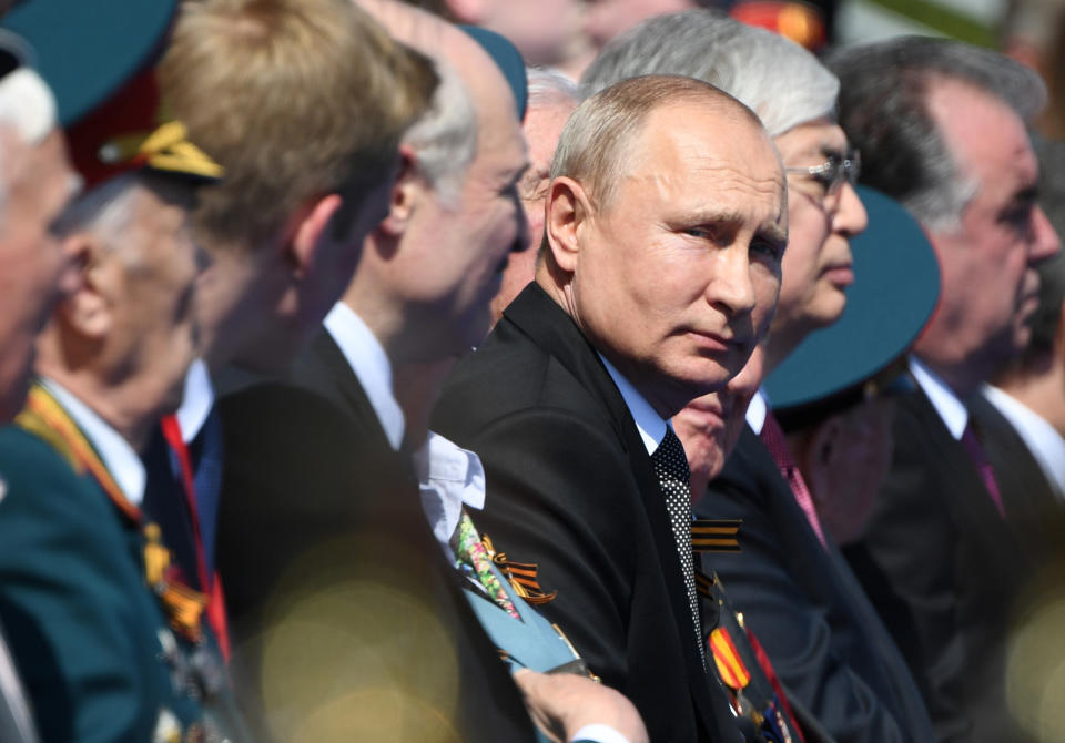 Russian President Vladimir Putin looks on during the Victory Day military parade marking the 75th anniversary of the Nazi defeat on Red Square in Moscow, Russia, Wednesday, June 24, 2020. The Victory Day parade normally is held on May 9, the nation's most important secular holiday, but this year it was postponed due to the coronavirus pandemic. (Sergey Pyatakov, Host Photo Agency via AP)