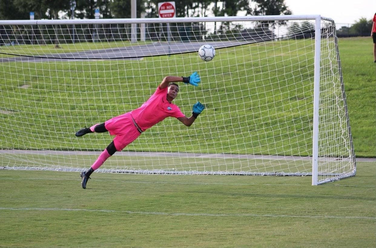 Lakeland's Junior Souza attempts to make a save. Souza vs. the GOSA Spurs made three penalty kicks last Saturday.