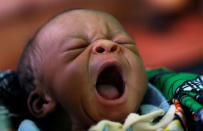 A newly born Congolese child yawns inside the maternity ward at the Kapangu maternity health centre in Kaniki-Kapangu near Mwene Ditu in Kasai Oriental Province in the Democratic Republic of Congo, March 15, 2018. REUTERS/Thomas Mukoya/Files