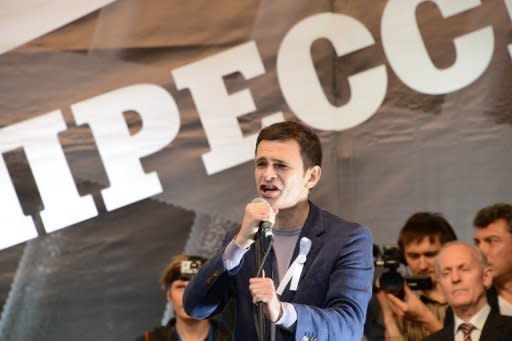 Russian opposition leader Ilya Yashin addresses the anti-Putin protest in Moscow. Tens of thousands of Russian opposition supporters have thronged the streets of Moscow to keep up the momentum of their challenge to Vladimir Putin's rule four months into his new mandate