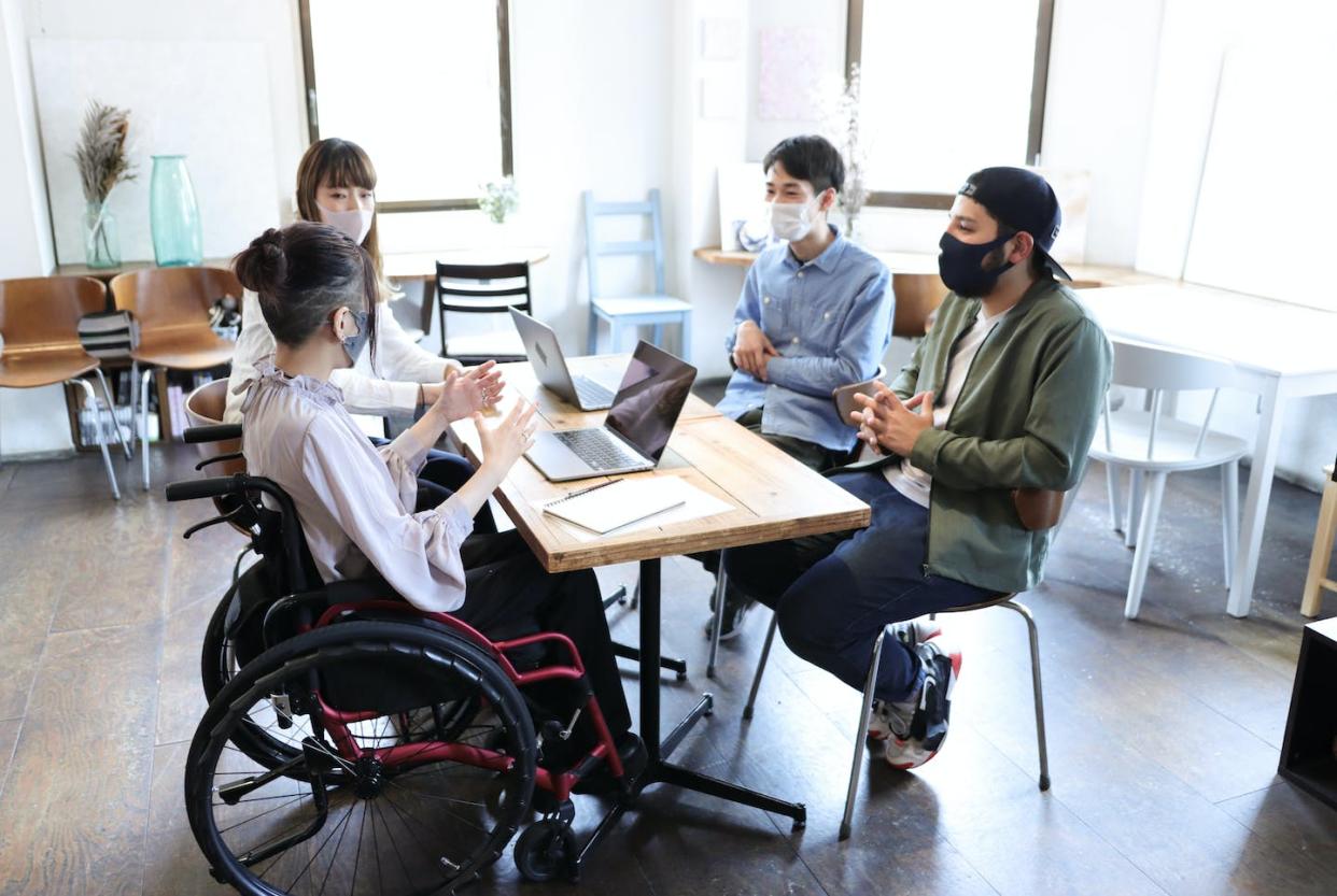 Building a more inclusive future means understanding why certain groups were absent in history. <a href="https://www.gettyimages.com/detail/photo/woman-on-wheelchair-with-her-collegue-at-office-royalty-free-image/1314933629" rel="nofollow noopener" target="_blank" data-ylk="slk:kyotokushige/DigitalVision via Getty Images;elm:context_link;itc:0;sec:content-canvas" class="link ">kyotokushige/DigitalVision via Getty Images</a>