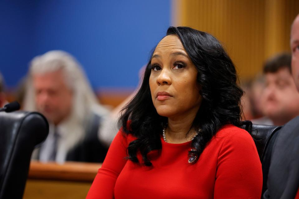 Fulton County District Attorney Fani Willis looks on during a Friday hearing to determine whether she should be removed from the Donald Trump election interference case over he relationship with Nathan Wade, special prosecutor she hired to lead the Trump prosecution.