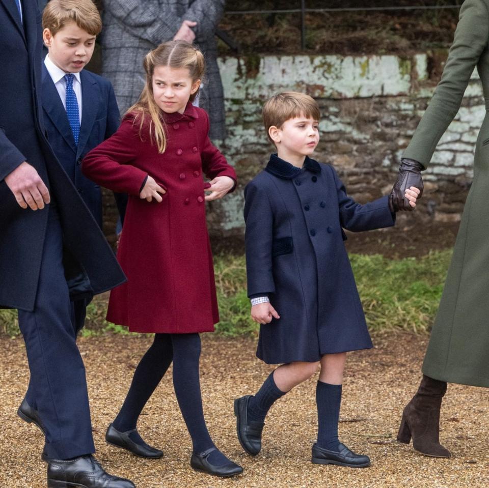 Prince Louis in a classic Trotters Heritage coat in navy, and Princess Charlotte in burgundy, on Christmas Day 2022