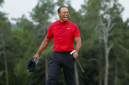 Golf - Masters - Augusta National Golf Club - Augusta, Georgia, U.S. - April 14, 2019 - Tiger Woods of the U.S. celebrates on the 18th hole after winning the 2019 Masters. REUTERS/Brian Snyder