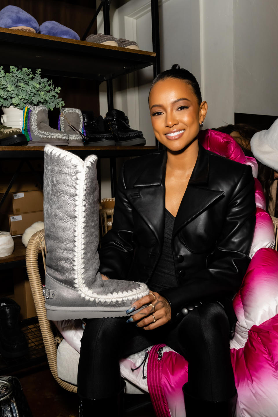 Karrueche Tran checks out Mou boots in the Collider Interview Studio at the 2023 Sundance Film Festival. - Credit: Photagonist.ca