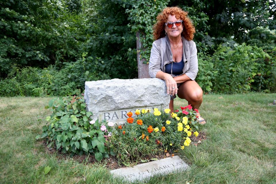 Colorado resident Marci Radin visits the grave of her biological half brother at First Parish Cemetery in York on Thursday, September 1, 2022.