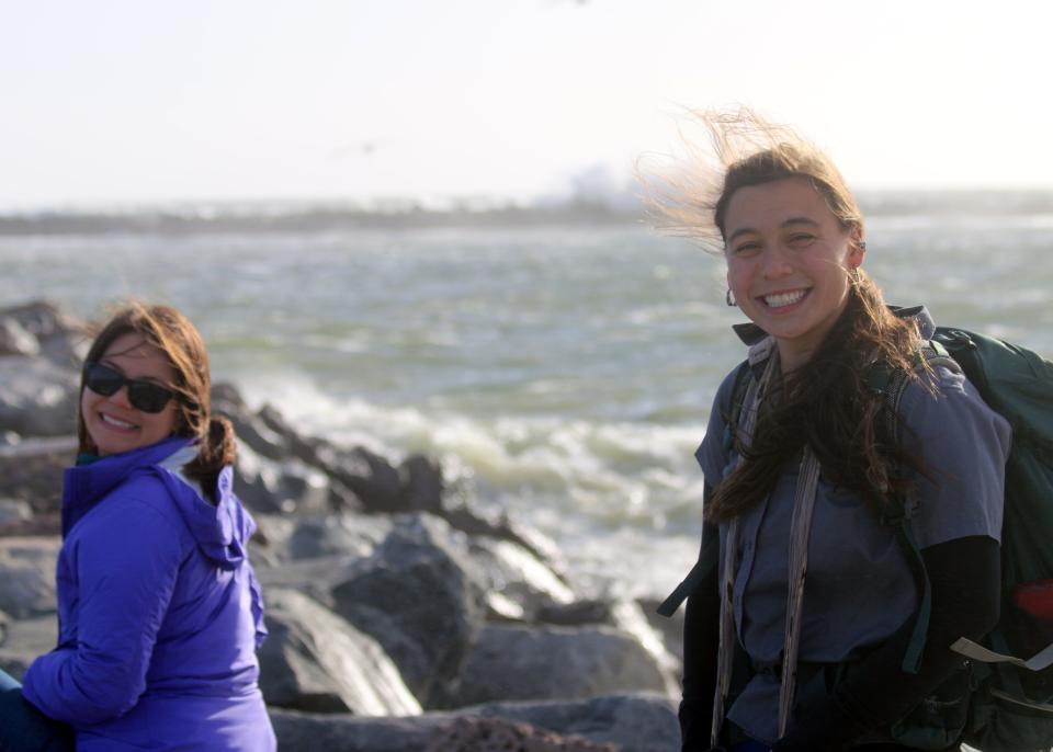 Kendra Chan, left, and Karen Sinclair, both biologists with the U.S. Fish and Wildlife Service, are shown during a brown pelican survey in 2017. Chan and her father were among 34 people killed in the 2019 Conception dive boat fire.