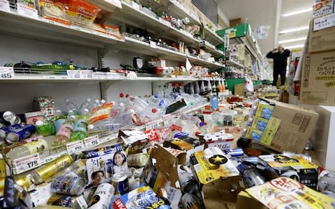 Shops and homes were damaged in the tremors - Credit: Kyodo/via REUTERS&nbsp;