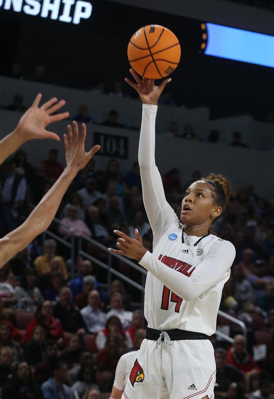 Louisville’s Kianna Smith tries to make the basket against Michigan.March 28, 2022