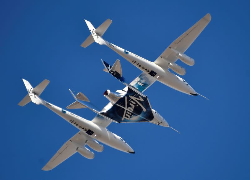 FILE PHOTO: Virgin Galactic rocket plane, the WhiteKnightTwo carrier airplane, with SpaceShipTwo passenger craft takes off from Mojave Air and Space Port