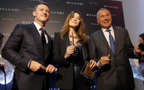 Actor Luke Evans, former French president Nicolas Sarkozy's wife Carla Bruni-Sarkozy and Bulgari Chief Executive Jean-Christophe Babin pose during a ribbon cutting ceremony to celebrate the opening of a new Bulgari store in Moscow, Russia, May 24, 2016. REUTERS/Maxim Shemetov