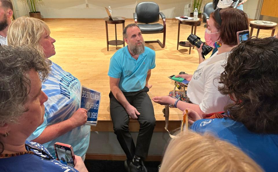 New College of Florida trustee Jason "Eddie" Speir speaks to people following a public meeting for students to meet the new trustees on Wednesday afternoon on campus.  