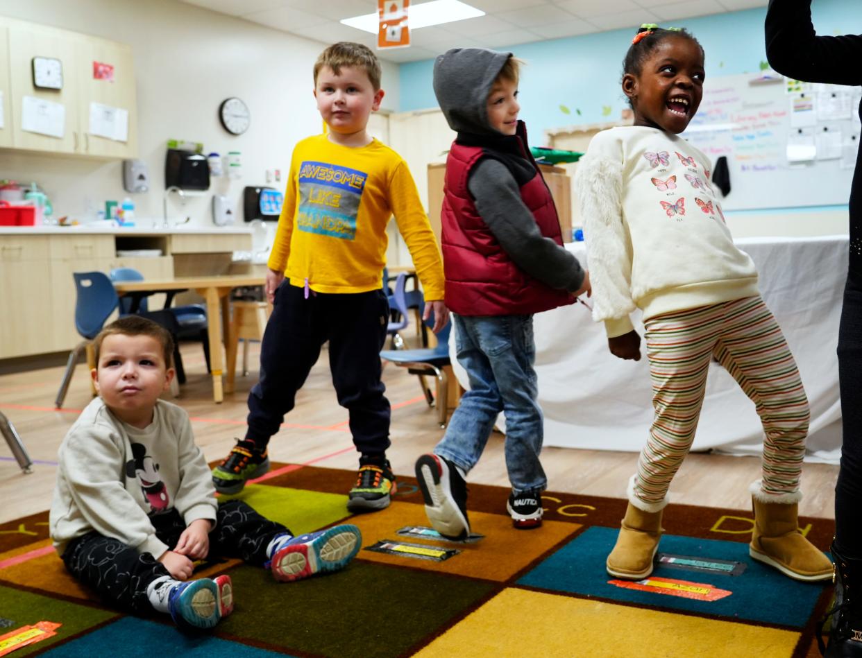 Kids do a freeze dance to Chirstmas music in a Cincinnati Children's Hospital Therapeutic Interagency Program called Tip in Walnut Hills on Dec. 11. The program can accommodate 72 kids, up from 48, since its move in September to the expanded space. These children have all experienced trauma and get mental health as well as educational services.