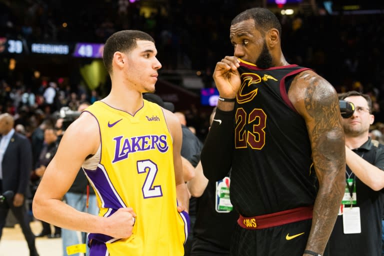 Lonzo Ball of the Los Angeles Lakers talks to LeBron James of the Cleveland Cavaliers after their NBA game at Quicken Loans Arena in Cleveland, Ohio, on December 14, 2017