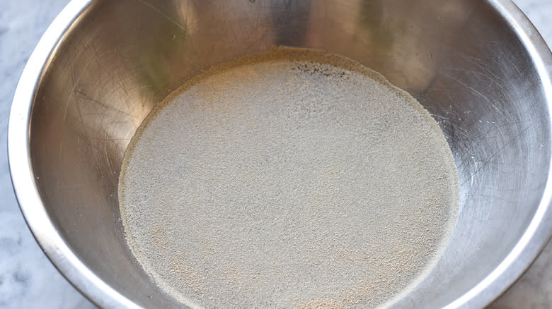 mixing bread dough in bowl