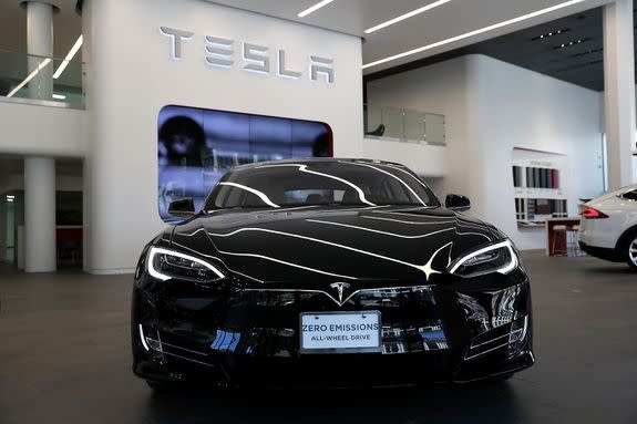 A Tesla Model S is displayed inside of the new Tesla flagship facility.