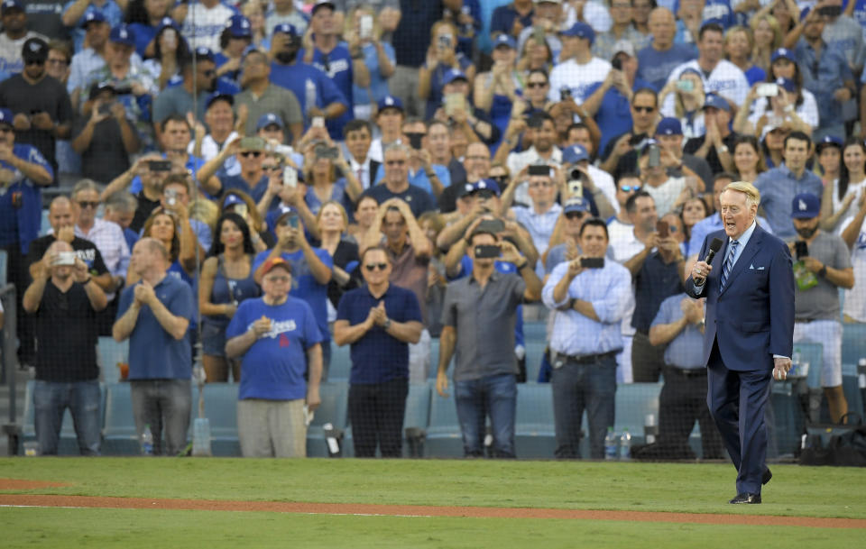 <p>Vin Scully helps throw out the ceremonial first pitch before Game 2 of baseball’s World Series between the Houston Astros and the Los Angeles Dodgers Wednesday, Oct. 25, 2017, in Los Angeles. (AP Photo/Mark J. Terrill) </p>