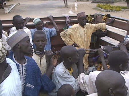 Former Nigerian hostages held by Boko Haram who were freed by the Cameroonian military arrive in Maroua, Cameroon, in this still image taken from a December 5, 2015 video footage. REUTERS/Reuters TV