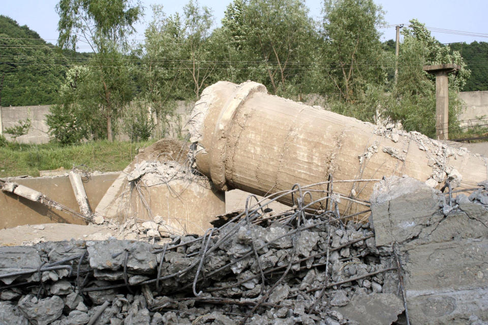 FILE - In this June 27, 2008, file photo provided by China's Xinhua News Agency, the ruins of the Yongbyon nuclear complex's cooling tower are seen after its demolition in Yongbyon, North Korea. The future of the key North Korean nuclear facility is on the table as North Korean leader Kim Jong Un and U.S. President Donald Trump prepare to meet in Vietnam on Feb. 27-28, 2019. The Yongbyon Nuclear Scientific Research Center, the heart of the North’s nuclear development and research, is Kim’s biggest carrot as he tries to win security guarantees and free his country from the U.S.-backed trade sanctions that are hobbling its economy. (Gao Haorong/Xinhua via AP, File)