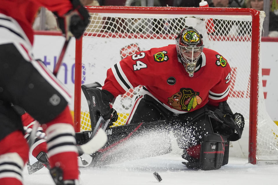 Chicago Blackhawks goaltender Petr Mrazek eyes the puck during the first period of the team's NHL hockey game against the Winnipeg Jets, Friday, Feb. 23, 2024, in Chicago. (AP Photo/Erin Hooley)