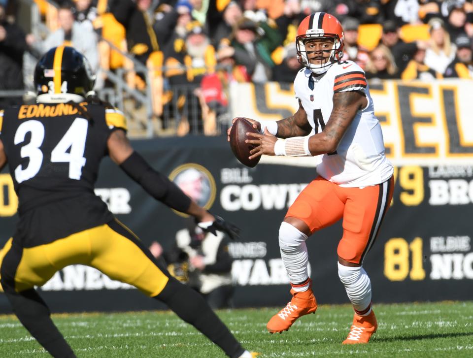 Browns quarterback Deshaun Watson scrambles from Steelers safety Terrell Edmunds during the first quarter, Jan. 8, 2023, in Pittsburgh.