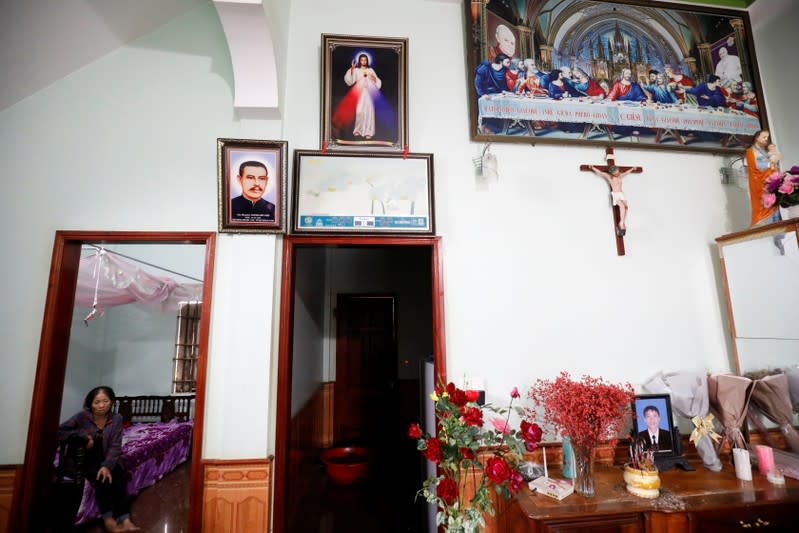 Anna Tran Thi Hien, mother of Anna Bui Thi Nhung, a Vietnamese suspected victim in a truck container in UK, sits on a bed at her home in Nghe An province