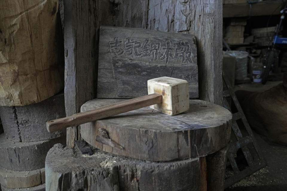 A gavel is placed in the Chi Kee Sawmill & Timber in Hong Kong, Tuesday, July 12, 2022. Chi Kee Sawmill & Timber, Hong Kong's last operating sawmill, has operated in the city for nearly four decades. But soon, the sawmill could be forced to shut down as authorities look to develop the area to make it more metropolitan and integrate it better with mainland China. (AP Photo/Kin Cheung)