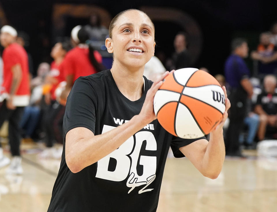 FILE - Phoenix Mercury's Diana Taurasi wears a T-shirt referring to teammate Brittney Griner before a WNBA basketball game against the Las Vegas Aces, Friday, May 6, 2022, in Phoenix. Brittney Griner said she's “grateful” to be back in the United States and plans on playing basketball again next season for the WNBA's Phoenix Mercury a week after she was released from a Russian prison and freed in a dramatic high-level prisoner exchange. “It feels so good to be home!” Griner posted to Instagram on Friday, Dec. 16, 2022, in her first public statement since her release. (AP Photo/Darryl Webb, File)