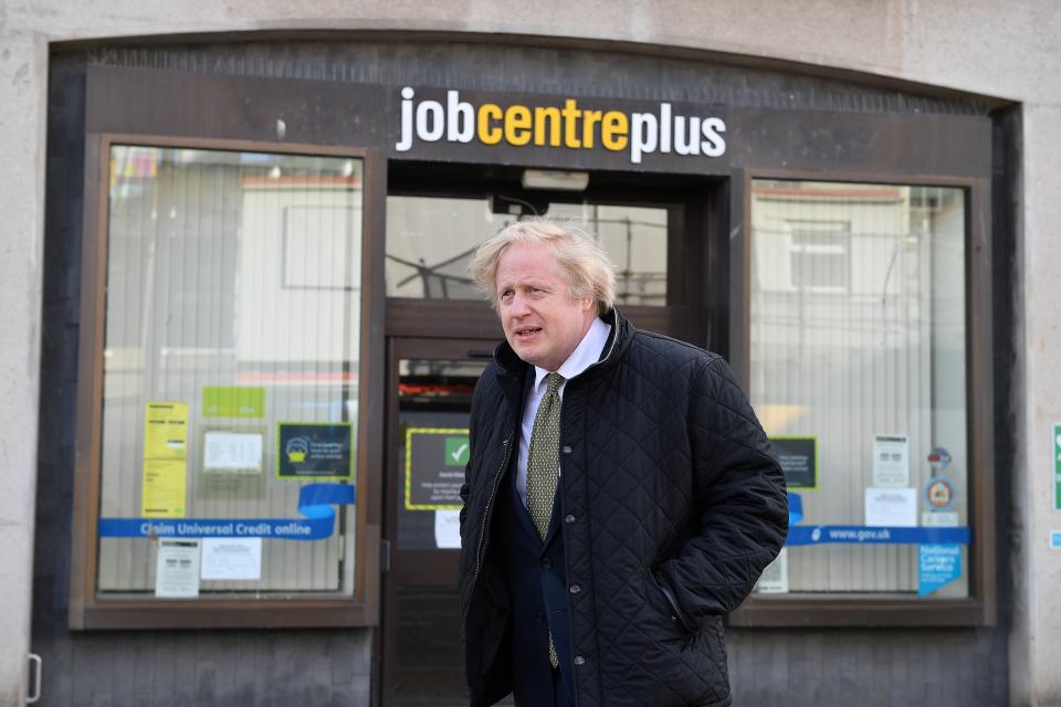 UK prime minister Boris Johnson walks past a Job Centre Plus in Truro, Cornwall, England during his visit to the region on 7 April. Photo: Justin Tallis/WPA Pool/Getty Images