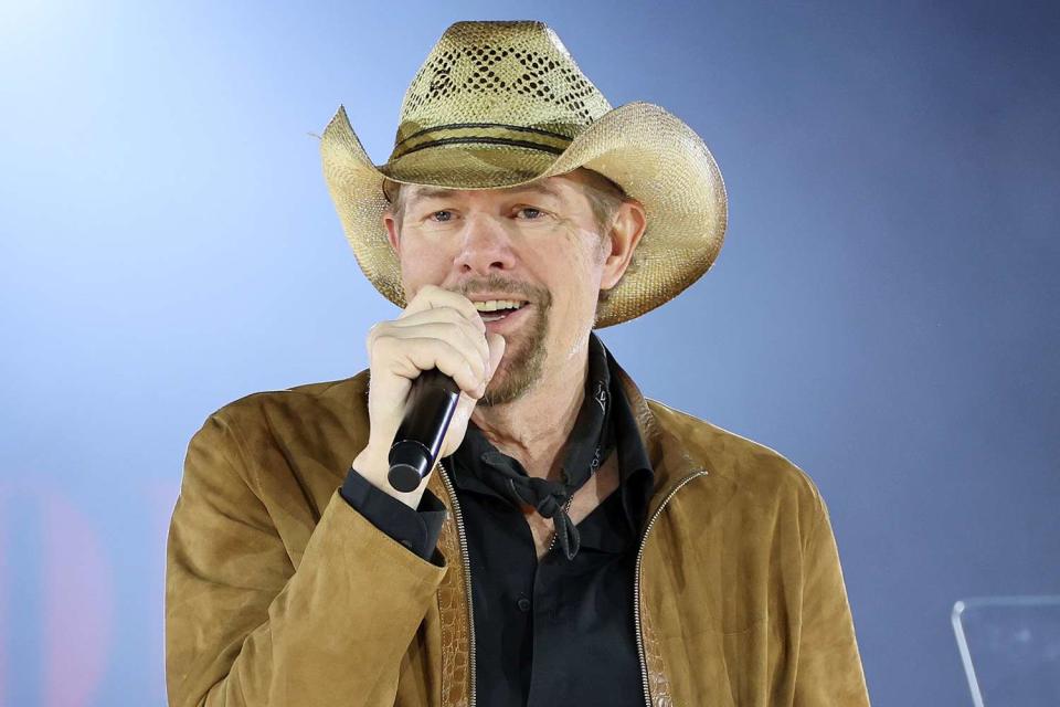 <p>Jason Kempin/Getty Images</p> Toby Keith performs onstage during the 2022 BMI Country Awards