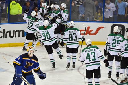 Dallas Stars teammates celebrate defeating the St. Louis Blues 3-2 in game four of the second round of the 2016 Stanley Cup Playoffs at Scottrade Center. Mandatory Credit: Jasen Vinlove-USA TODAY Sports