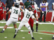 Hawaii quarterback Chevan Cordeiro passes downfield against Fresno State quarterback during the first half of an NCAA college football game in Fresno, Calif., Saturday, Oct. 24, 2020. (AP Photo/Gary Kazanjian)