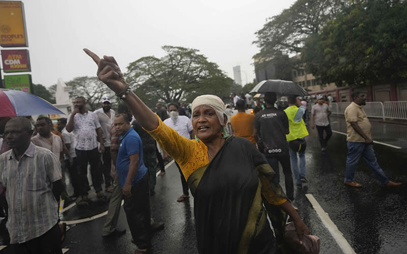 Supporters of Sri Lanka's main opposition shout slogans after police stopped their march